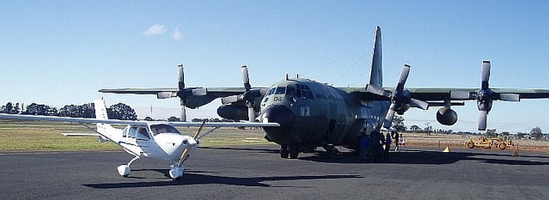 Brownie's J230 is dwarfed by a RAAF C130 Hercules